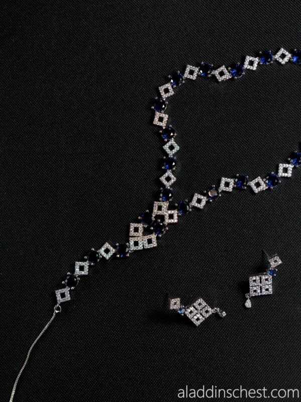 Elegant diamond necklace and earrings set on black
