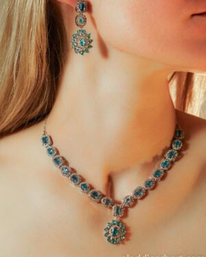 Woman wearing turquoise and silver jewelry set