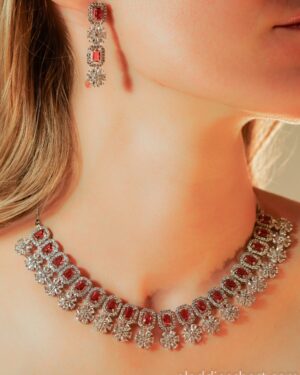 Elegant red gemstone necklace and earrings set.