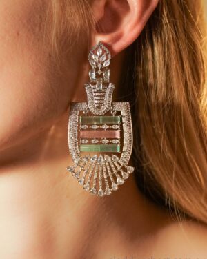 Elegant diamond earrings on woman's ear