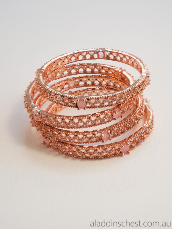 Stack of elegant rose gold bangles