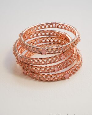 Stack of elegant rose gold bangles