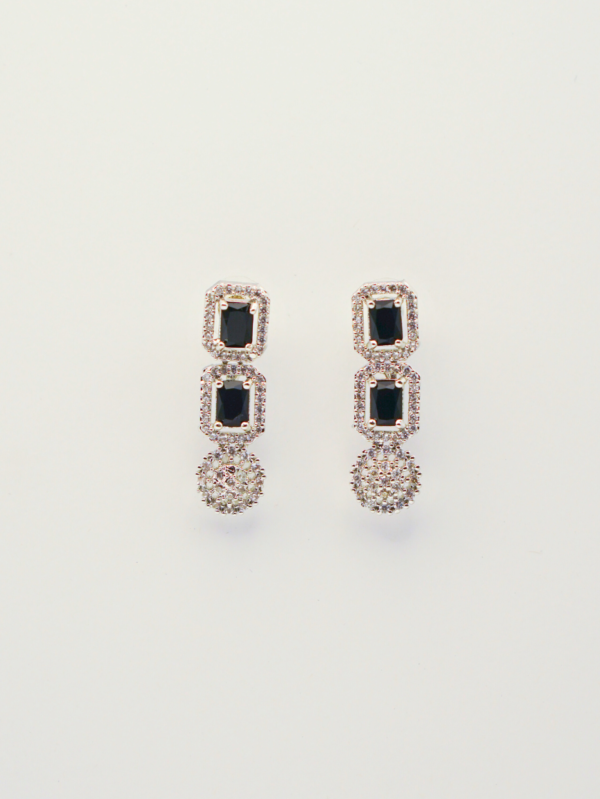 Elegant black gem earrings with diamond accents.