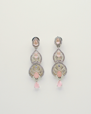 Elegant pink gemstone dangle earrings on white background.