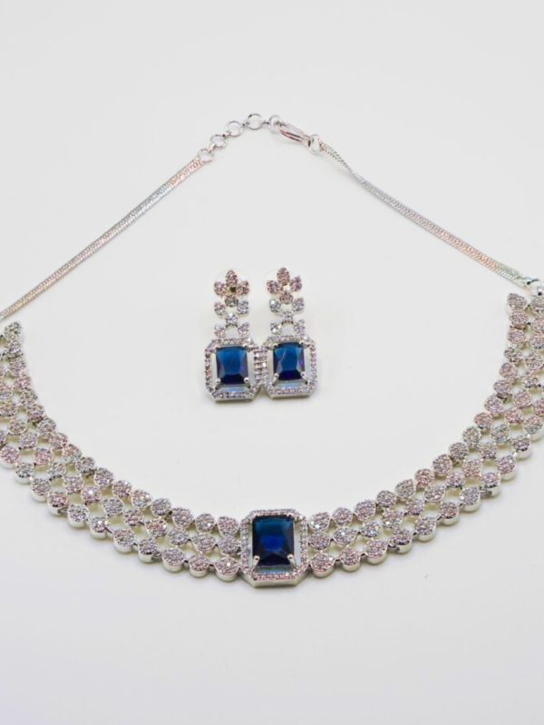 Elegant necklace and earrings set with blue gemstones