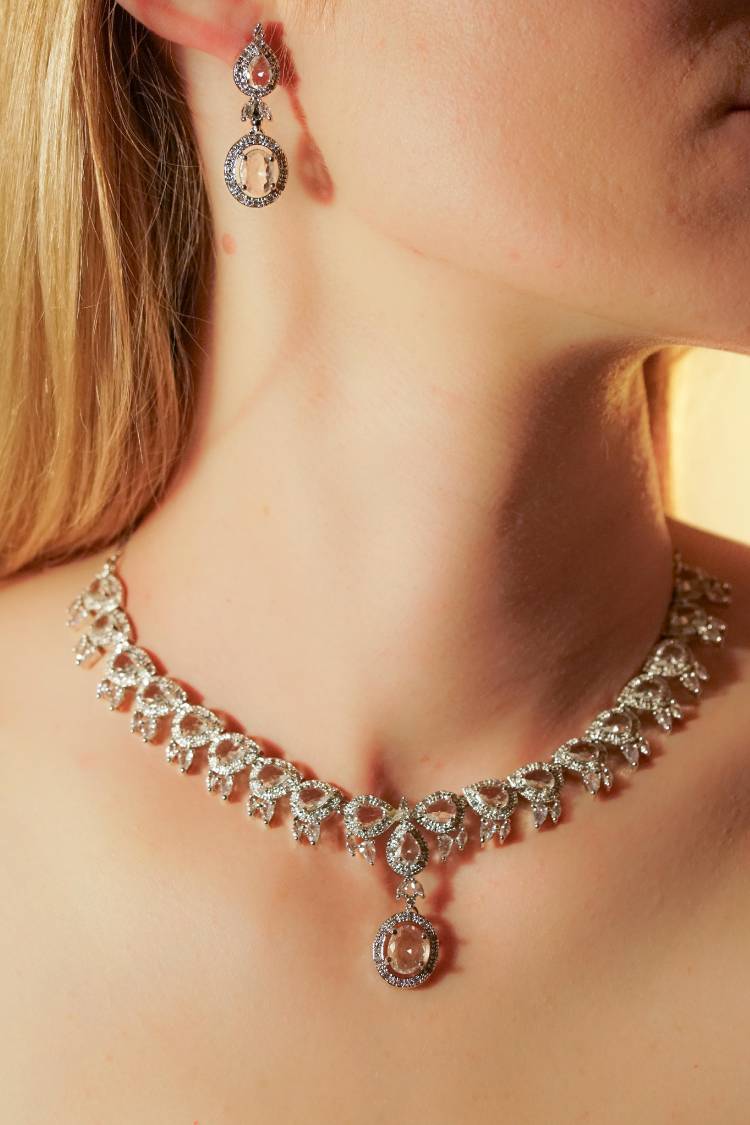 Elegant diamond necklace and earrings on woman
