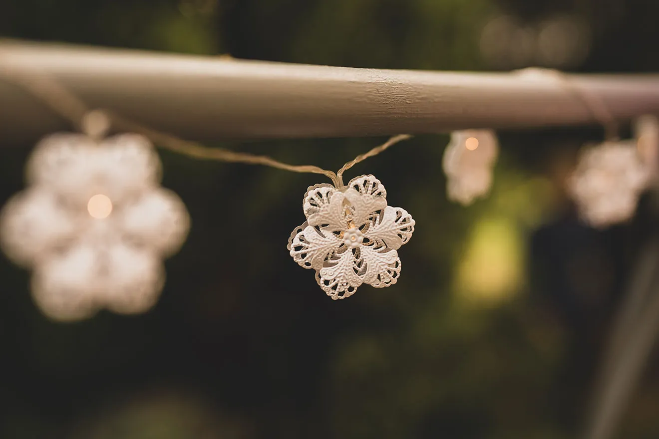 Close-up of decorative hanging crochet flowers.
